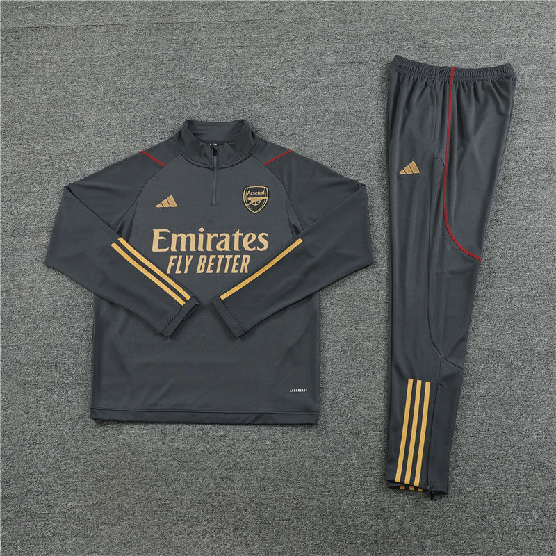 Arsenal Grey Tracksuit laid flat, showcasing its modern design.